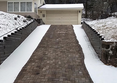 Heated paver driveway after a snowstorm.