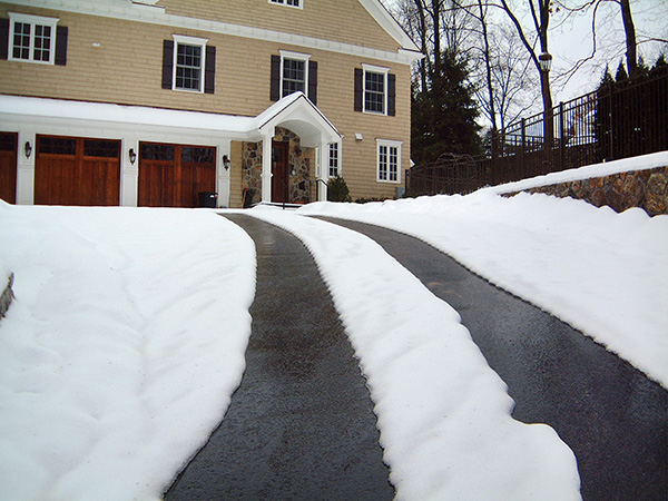 A heated driveway in asphalt (heated tire tracks).